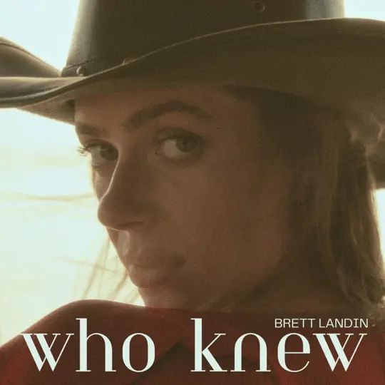 A woman wearing a cowboy hat