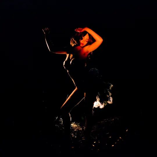 A woman dancing in the dark