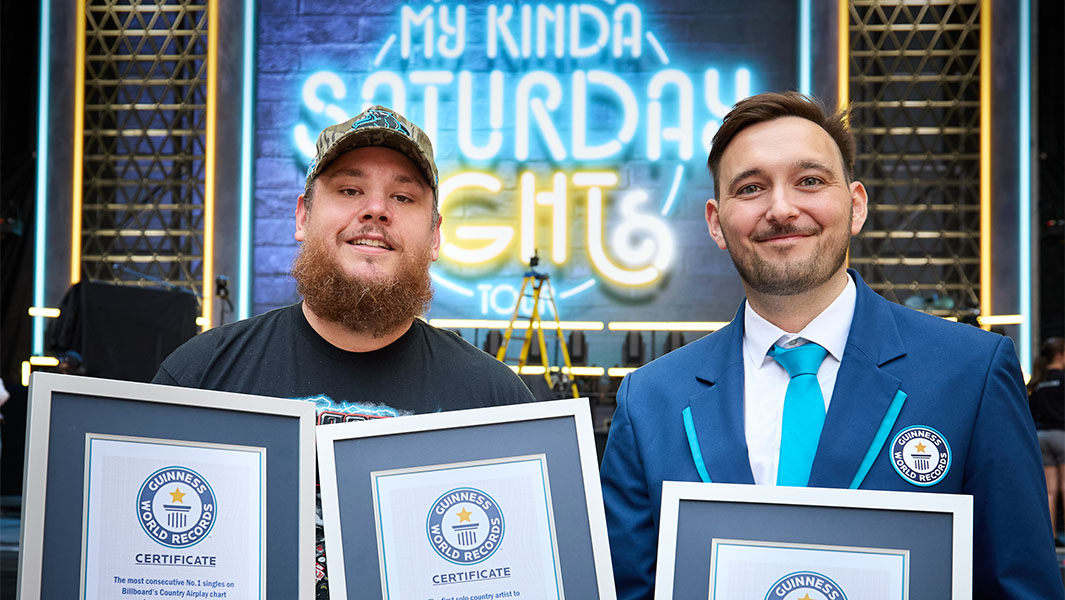 Will Munford presents Combs with the Official Guinness World Records 